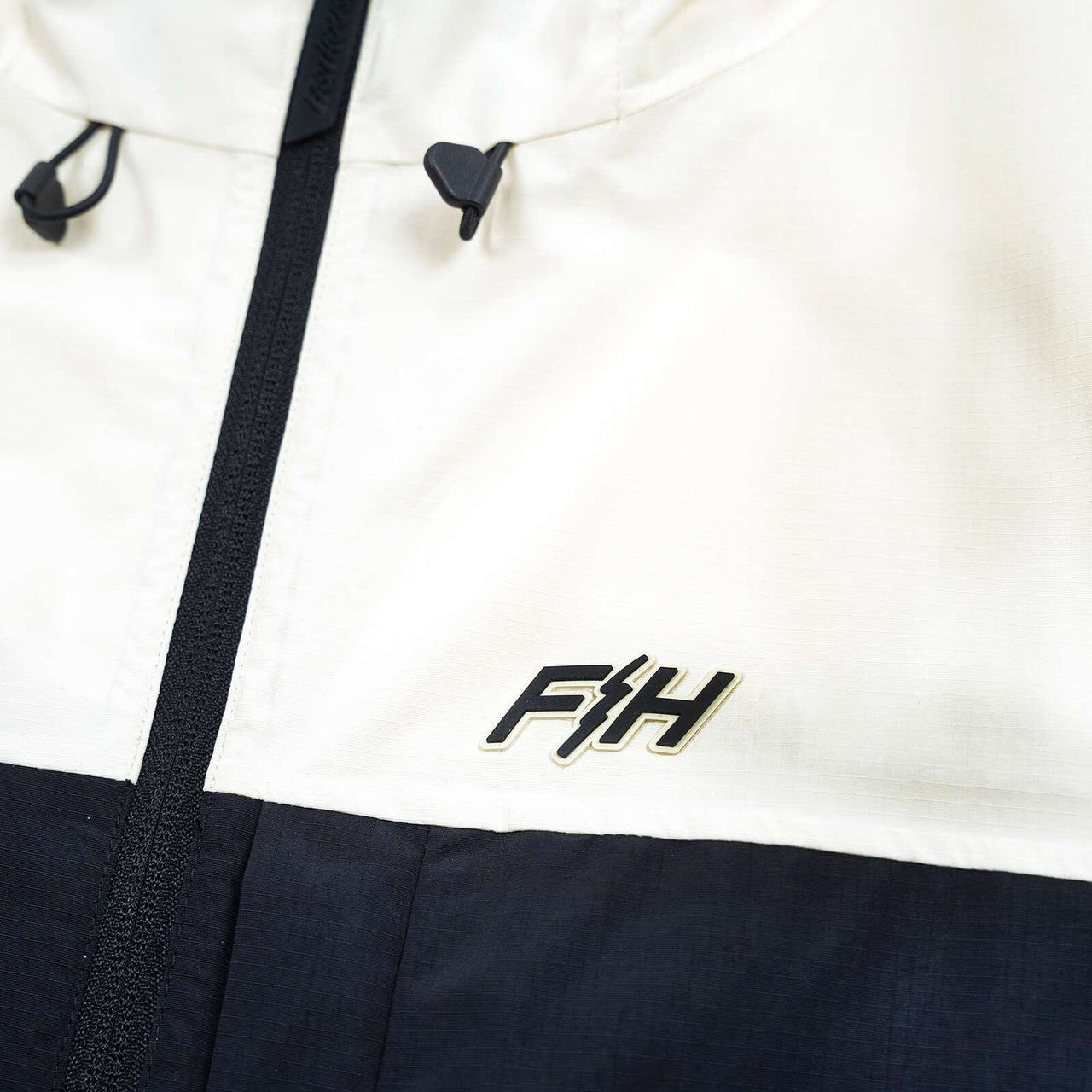 Fasthouse-Statement-Packable-Windbreaker-Hoodie-detail